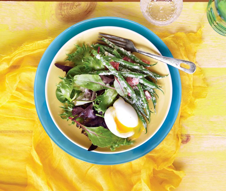 Creamy bean salad with soft-boiled egg on a yellow and blue plate for a post on an easy Creamy bean salad with soft-boiled egg recipe