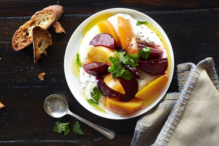 Mediterranean beet plate made with yellow and red beets; green yogurt; mascarpone; caraway seeds and parsley