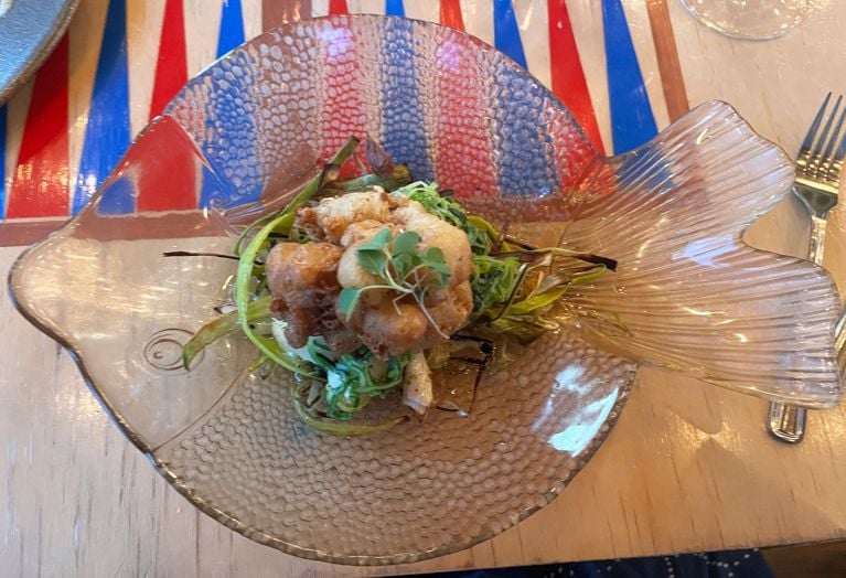 surf clams on cod at La Marmite in Malbaie on a fish-shaped plate