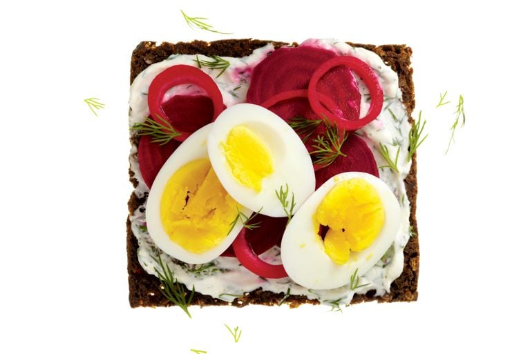 swedish egg, beet and dill sandwich: boiled eggs; quick-pickled beets and onions over dill and horseradish sour cream with fresh dill on rye bread for a post on an easy Swedish egg beet and dill sandwich recipe