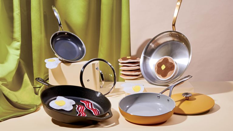 Four frying pans holding various types of felt food for a feature on the best brands for frying pans.