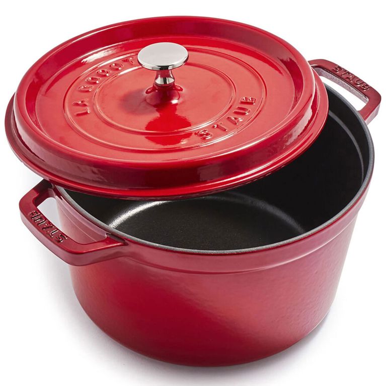 A Staub dutch oven in cherry colour.