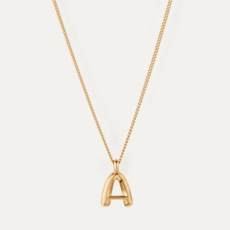 A gold Jenny Bird Monogram Necklace for an article about the best purchases our editors made in August 2025.