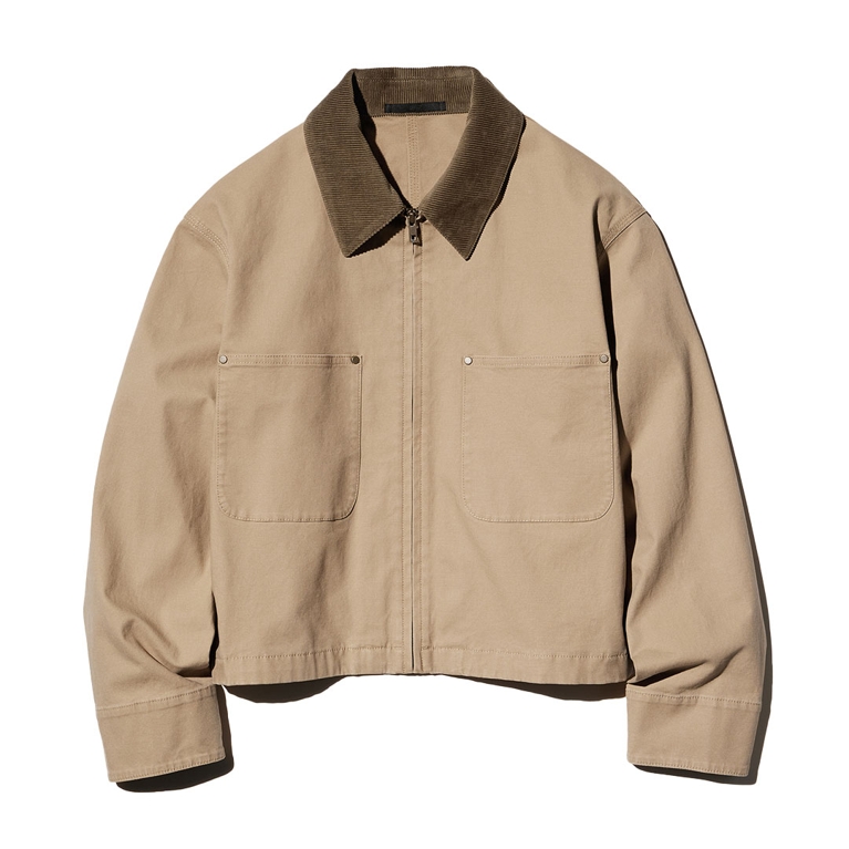 A beige chore jacket from Uniqlo for an article about how to wear the fisherman fashion trend this fall.