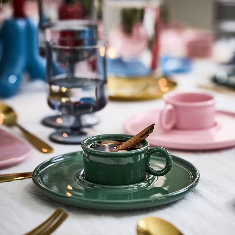 A table set with a green and pink espresso cup from the Gustaf Westman IKEA Christmas collection 2025 in Canada.