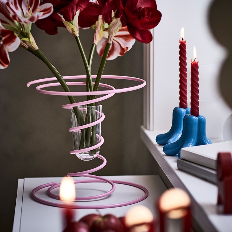 A pink spiral vase on a sideboard from the Gustaf Westman IKEA Christmas collection 2025 in Canada.