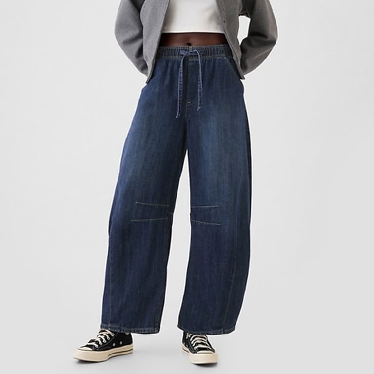 A model wearing denim Gap barrel pants for an article about updated basics for fall 2025.