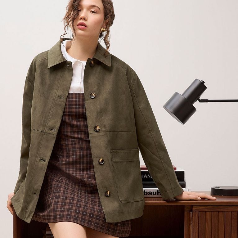 A model wearing a green Simons suede jacket for an article about updated basics for fall 2025.