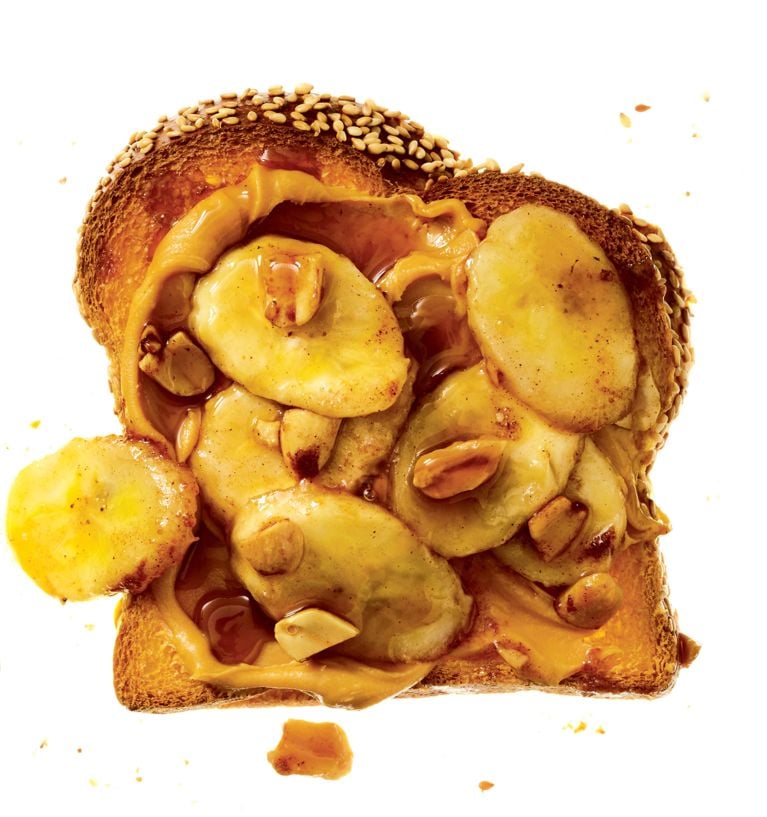 A peanut butter and banana sandwich with decadent rum bananas and peanuts