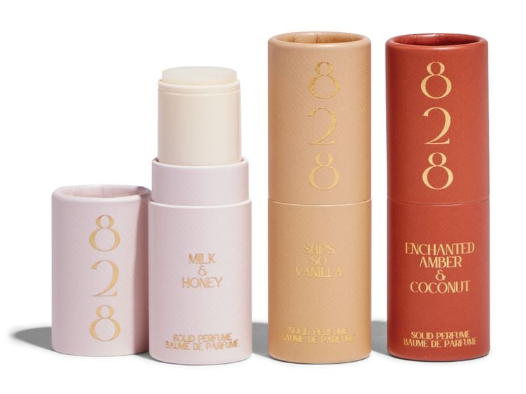 Three tubes of 828 Aroma solid perfumes.
