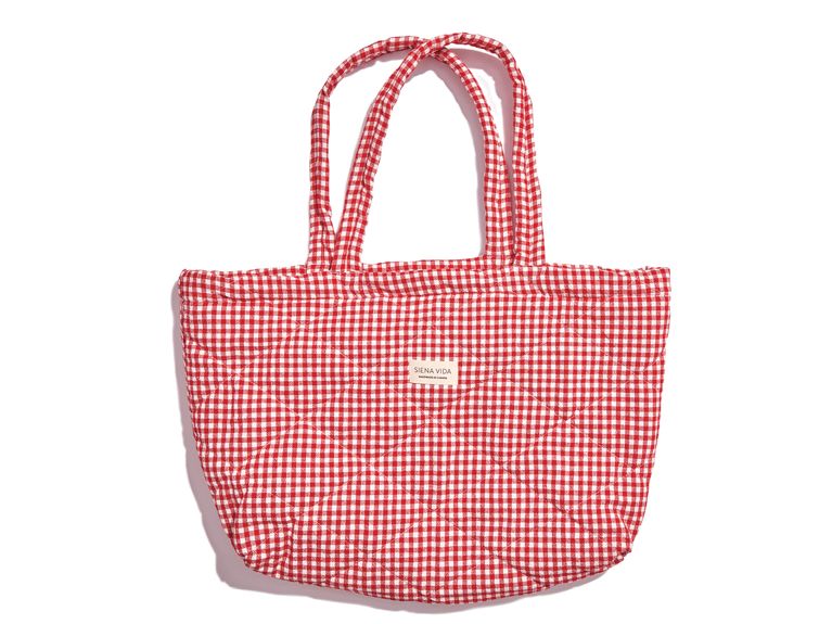 A red-and-white plaid quilted tote bag from brand Siena Vida.