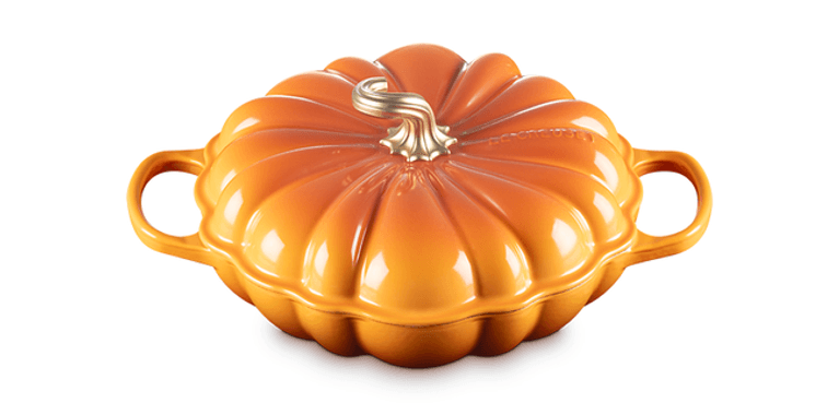 A persimmon (orange) Le Creuset pumpkin braiser