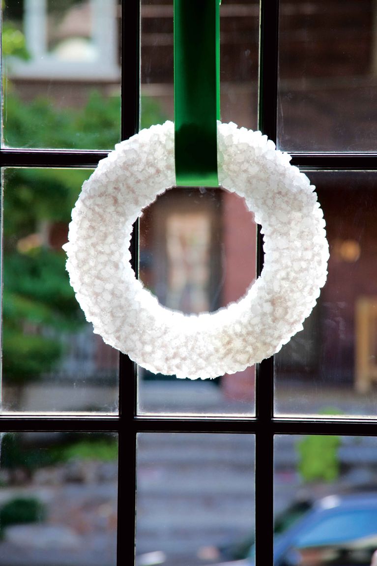 a festive, glowing wreath made of rock sugar on a wreath form hung with a green velvet ribbon for a post on a christmas wreath craft