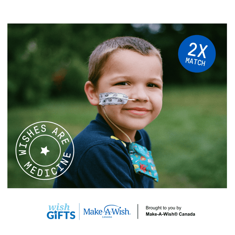 young boy with a feeding tube smiling with grass background