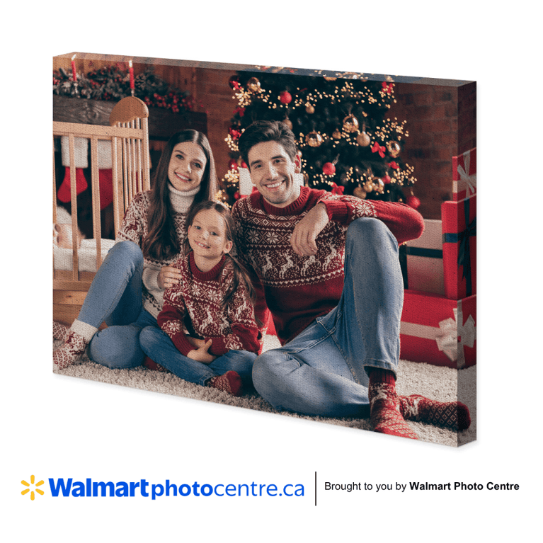 Festive canvas photo of happy family in front of Christmas tree.