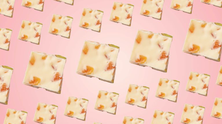 Assorted cookies on a pink background with the words in white "Find more Christmas cookie recipes"