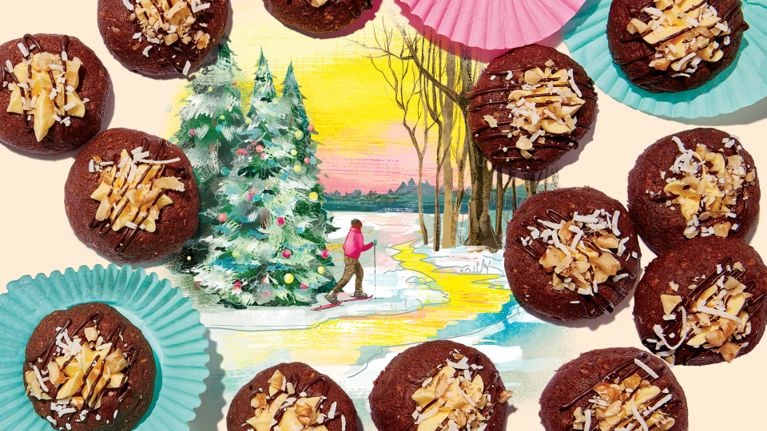 Assorted cookies on a pink background with the words in white "Find more Christmas cookie recipes"
