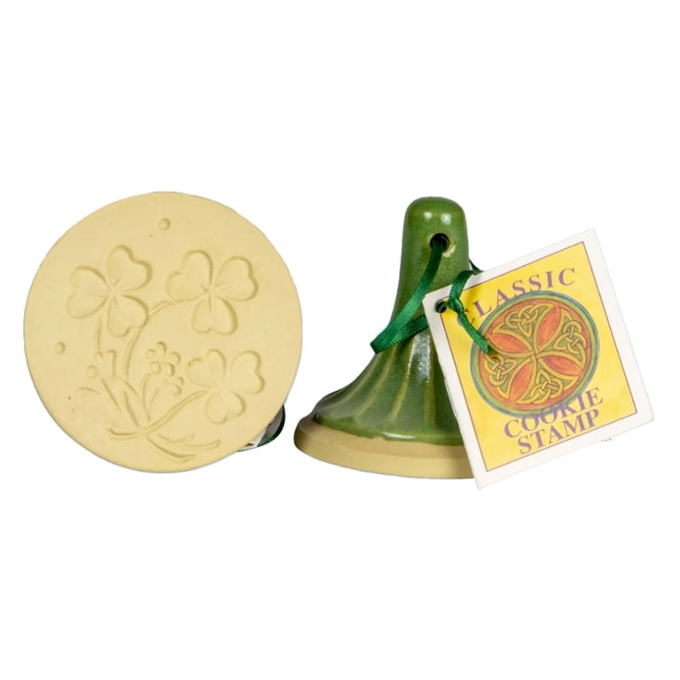 Green ceramic cookie stamp with a thistle pattern