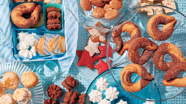 A variety of gluten-free, nut-free and dairy-free cookies are piled on various plates for a story on allergen-free cookie swaps.