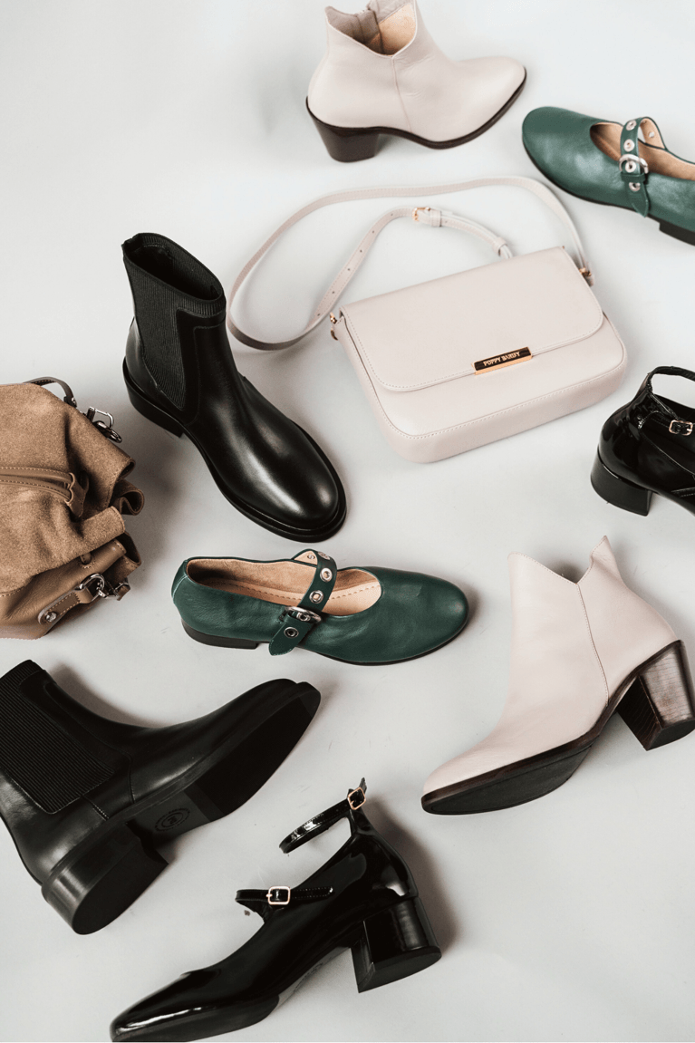 an array of Poppy Barley shoes boots and purses on sale for Black Friday