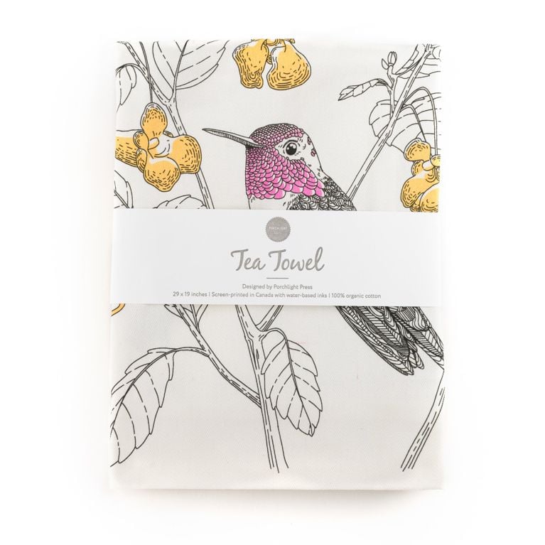 A tea towel with an Anna's hummingbird on it for the best christmas or holiday gifts under $50, the tea towel is by porchlight