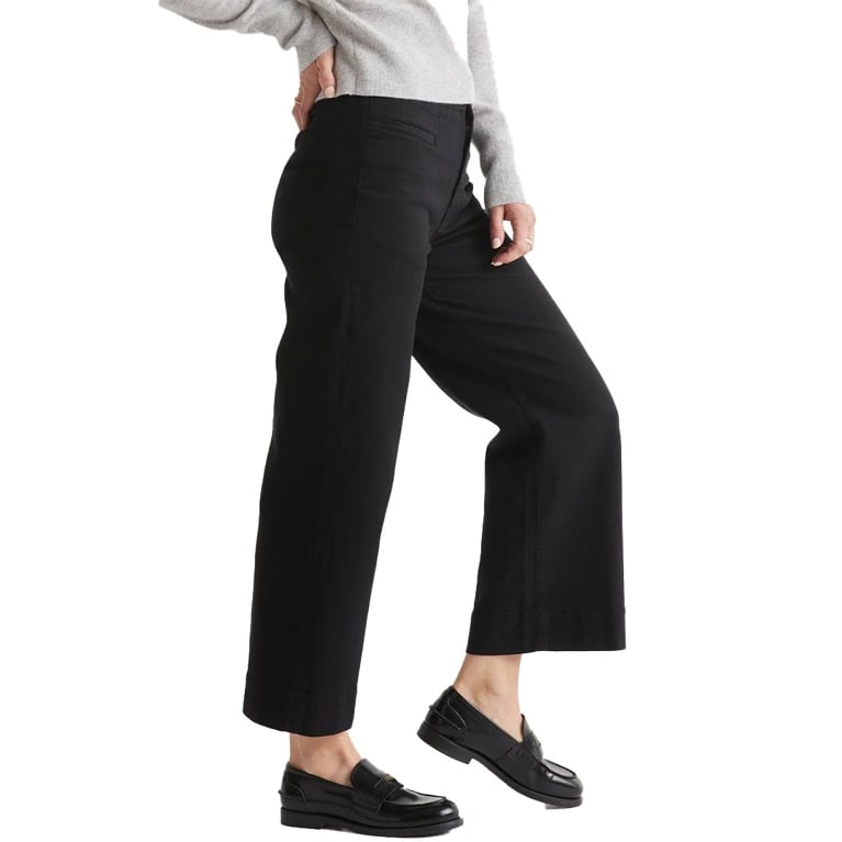 A woman wearing a pair of black Duer trousers in a best black Friday deals Canada post.