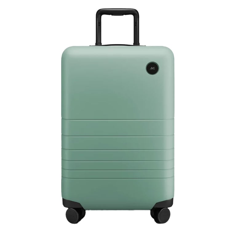 A mint green carryon suitcase from Monos in a post about best black friday deals.