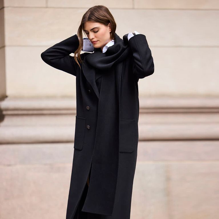 A black coat with a removable scarf from RW&Co, for a post about the best Black Friday deals in Canada.