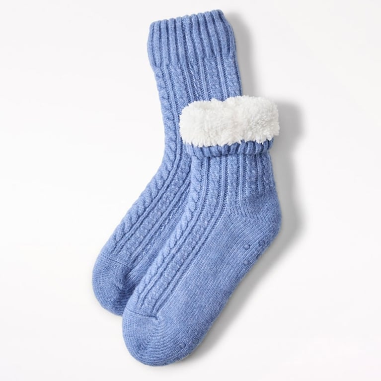 A pair of blue Indigo Reading Socks for an article about the best self-care gifts for pampering for the holidays.