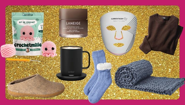A selection of pampering gifts on a tinsel purple background for an an article about the best self-care gifts for 2024.