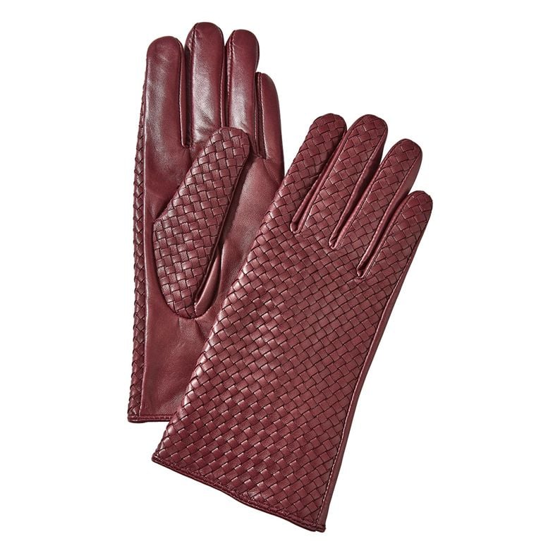 A pair of burgundy woven leather gloves from winners for an article about the best stocking stuffer gift ideas for 2025.