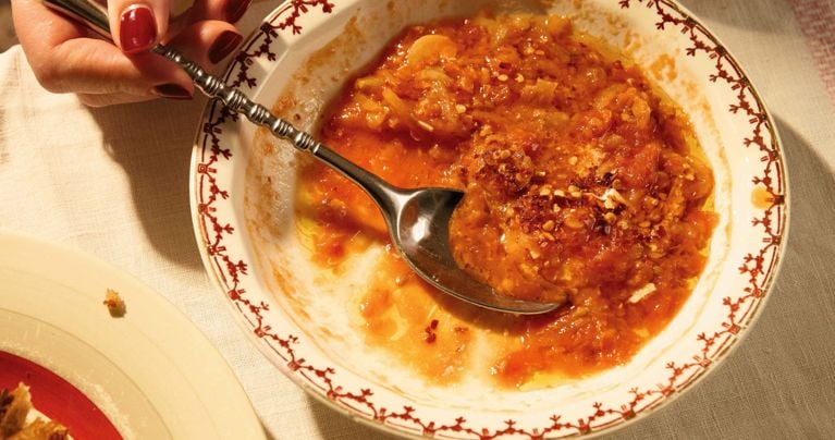 A bowl of buttered tomato soup with lentils from Alison Roman's Something from Nothing.