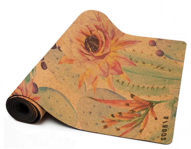 A cork yoga mat with a floral watercolour print in a post about best fitness gifts.