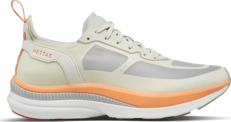 An orange and white running shoe from Hettas in a post about bet fitness gifts.