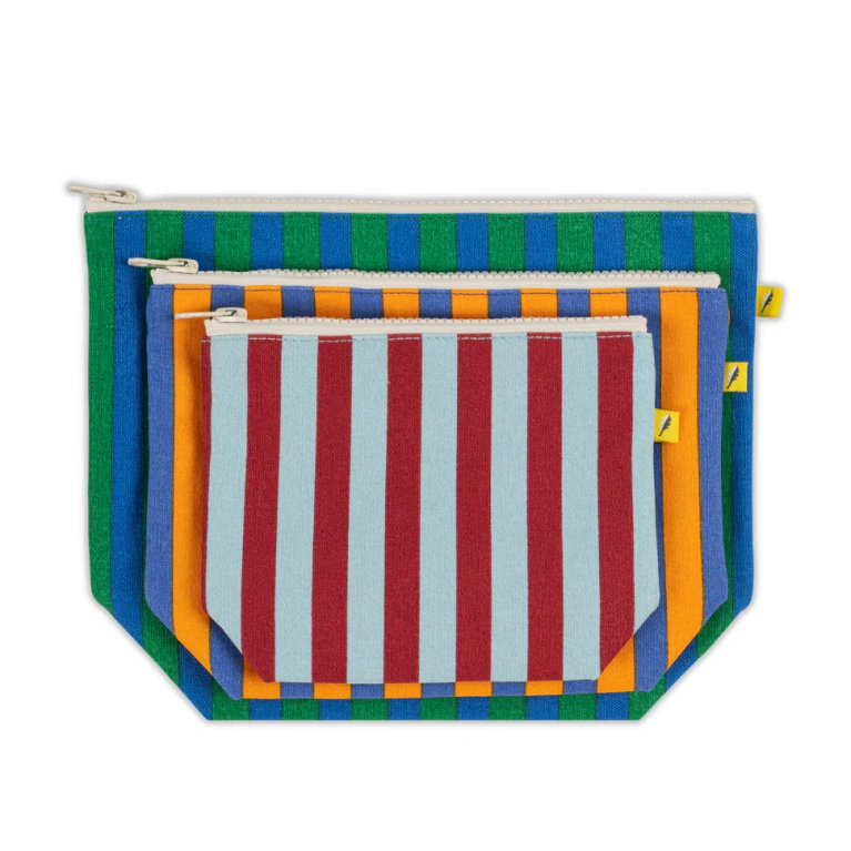 a set of three striped Fluf pouches, one in red and blue; one in orange and blue; and one in green and blue for a post on the best budget gifts in canada under $50