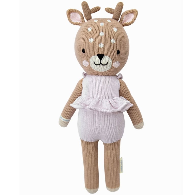 A soft knit reindeer children's toy in a post about gifts that give back.
