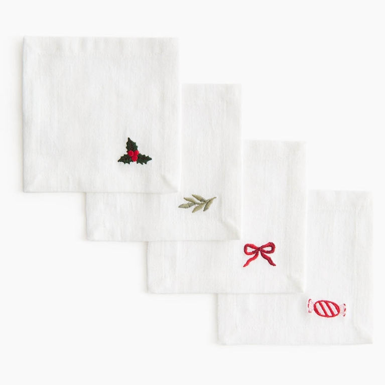 A set of four embroidered cocktail napkins for an article about the best H&M Home holiday decor pieces for 2025.