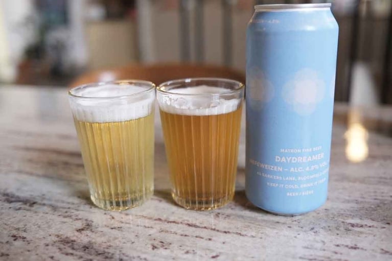 Matron's daydreamer in a can next to two glasses of beer