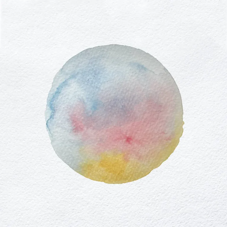 A Jilly Francis round globe painted in water colour pastels in a post on the one of a kind christmas show.