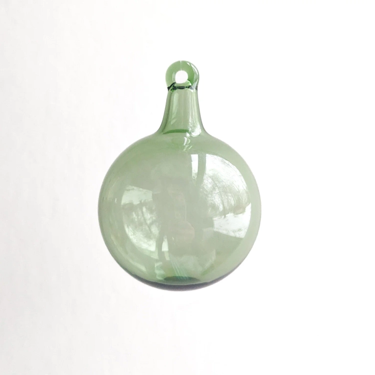 A green silvia taylor round hand blow glass ornament