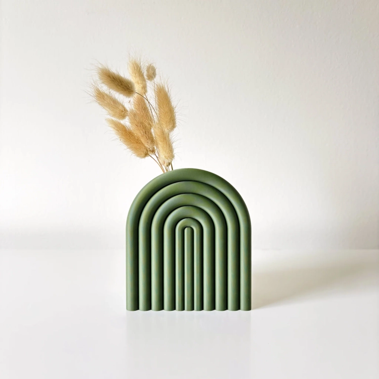 Sonnihaus Arc Vase, $26, in green with a sprig of dried wheat in it