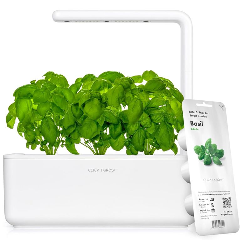 A white Click & Grow Hydroponic Indoor Garden with basil growing for a post about tech gifts for the holidays.