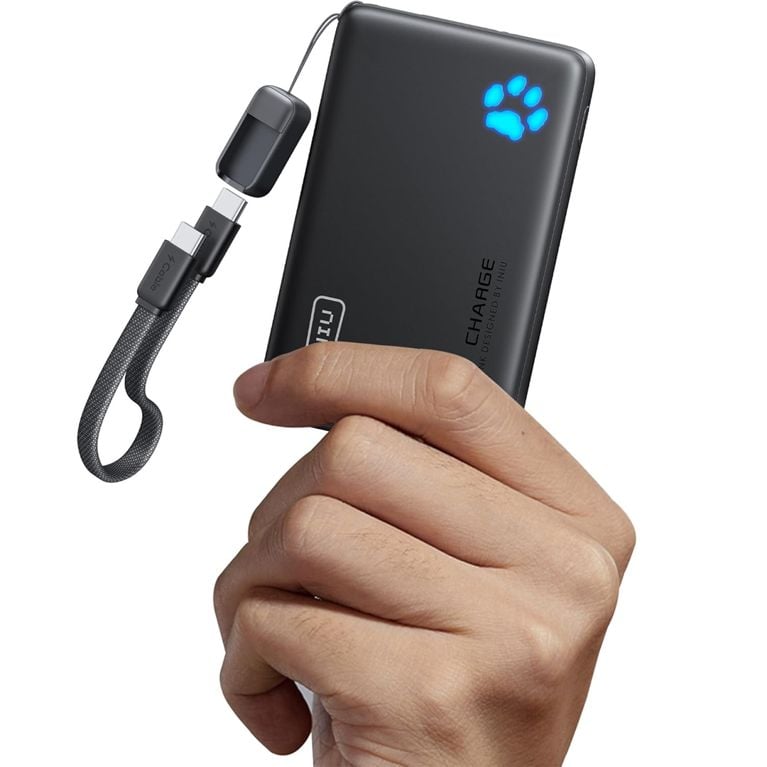 A hand holding the mini INIU power bank for a post about the best tech gifts for the holidays.