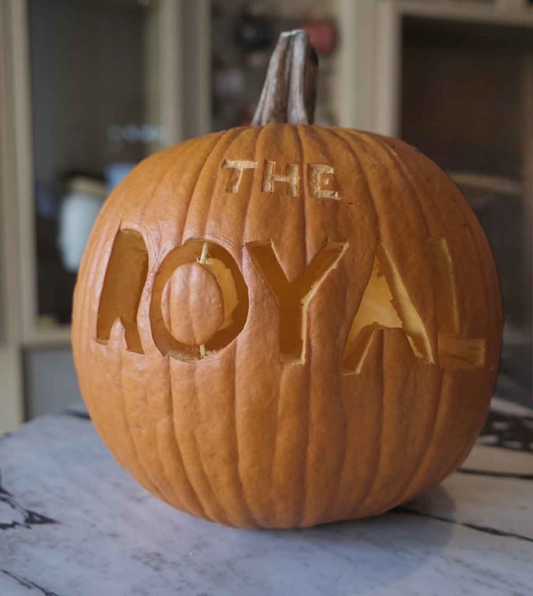 A pumpkin carved to say "the Royal" in it at the Royal Hotel