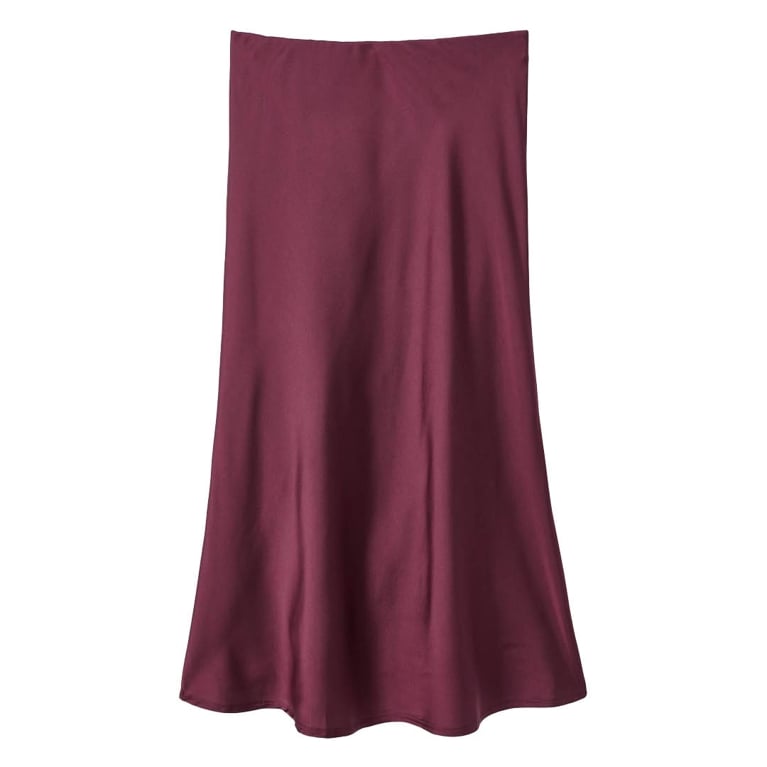 A burgundy George satin skirt for an article about the best purchases our editors made in November 2025.