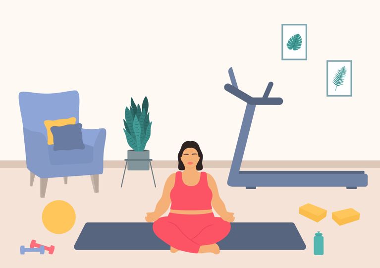 A woman meditating in her home gym surrounded by fitness equipment in a post about peloton menopause content.