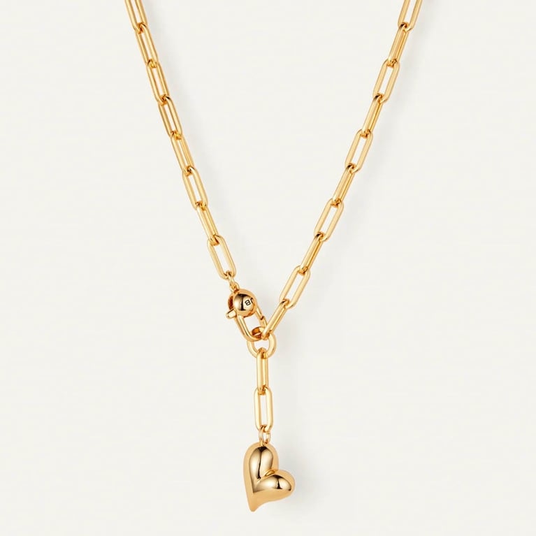 A gold Jenny Bird Puffy Heart Necklace for an article about what our editors want for Valentine's Day.