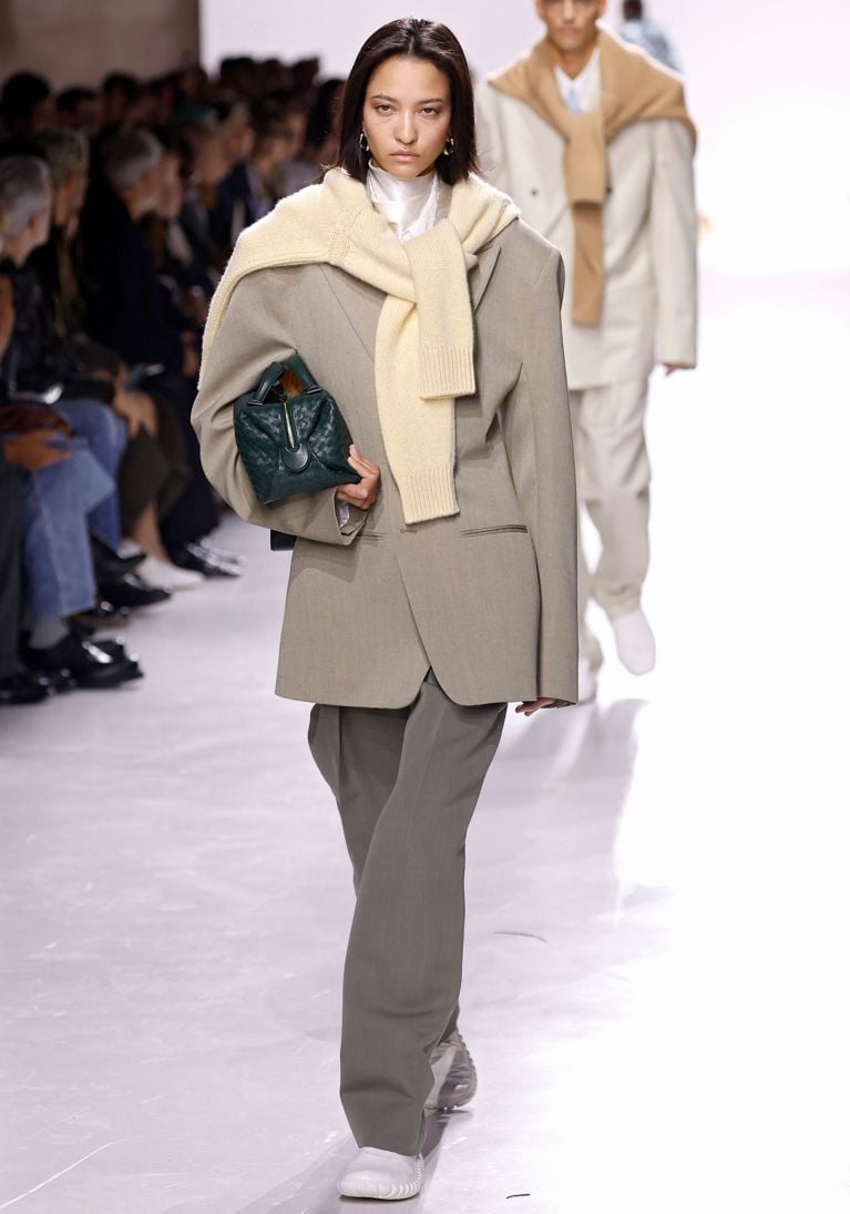 A model wearing a sweater over her shoulder at the Bottega Veneta Spring-Summer 2026 show for an article about the best fashion trends of 2026.