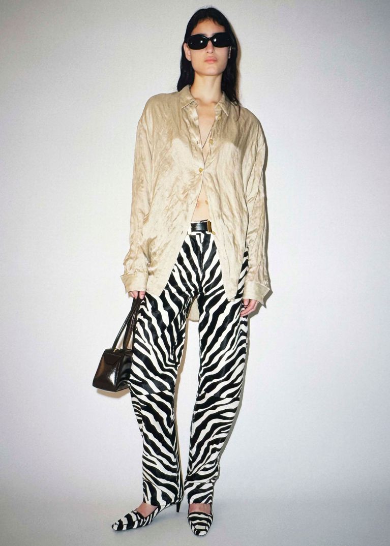 A model wearing zebra print from the Khaite Resort 2026 show for an article about the best fashion trends of 2026.