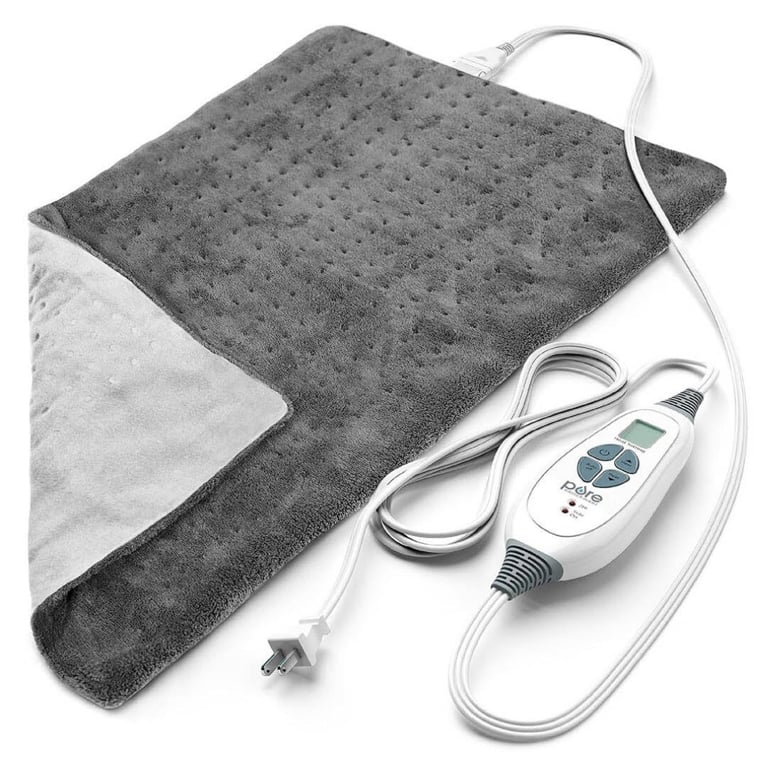 A heating pad with a grey cover for an article about how to curate a cozy night in.
